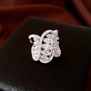 Detailed view of elegant twisted silver ring encrusted with clear cubic zirconia
