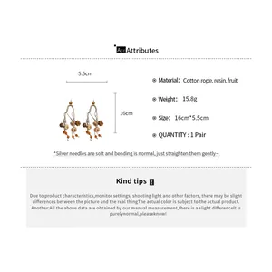 Detailed size and material specifications for autumn pumpkin tassel earrings