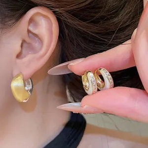 Elegant brushed gold and white crystal encrusted geometric hoop earrings for women