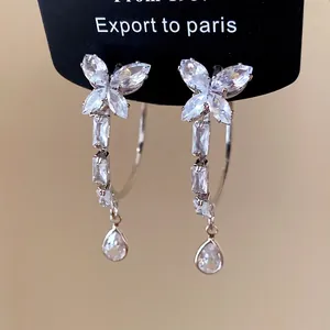 Elegant silver butterfly earrings with sparkling cubic zirconia teardrop tassels.