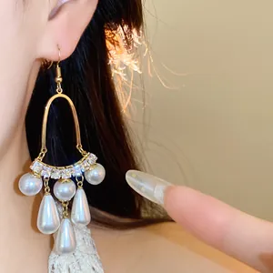 Elegant French style pearl drop earrings with gold hooks and sparkling crystals