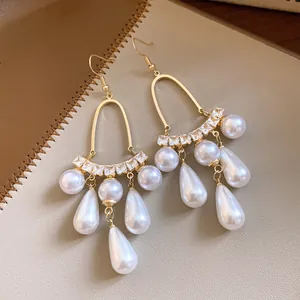 Elegant French style pearl tassel drop earrings with gold hooks and clear zirconia accents