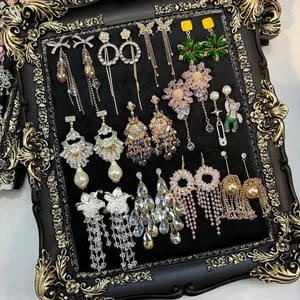 Elegant vintage zircon floral tassel earring collection on luxurious velvet frame
