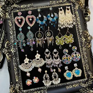 Vintage tassel stud earrings set with vibrant zircons and crystals in an ornate frame
