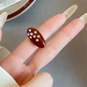 Vintage red enamel oval ring with sparkling rhinestone inlay details