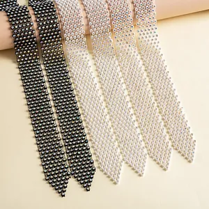 Detail of sparkling rhinestone tie necklaces in black and white styles