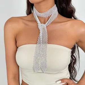 Detailed view of a sparkling rhinestone woven necktie necklace worn by a female model