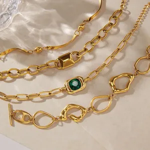 Four styles of elegant gold-plated stainless steel bracelets with green gemstone.