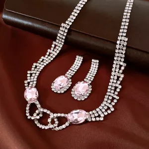 Elegant pink crystal necklace and earrings set with sparkling rhinestones for parties