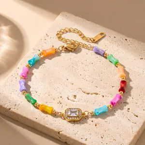 Close-up of colorful bamboo shell beads and sparkling zircon center on gold chain