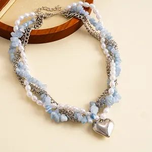 Vintage gelaagde parel- en blauwe steenketting met een gepolijste zilveren hart hanger