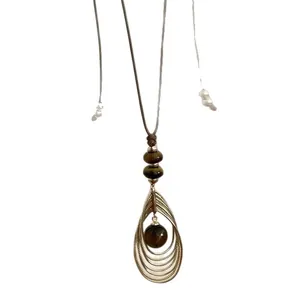 Vintage tijgeroogsteen hanger ketting met bruin koord, retro-esthetische stijl