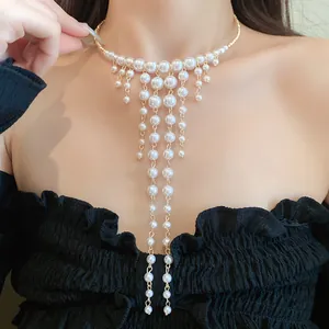 Elegant French court style pearl choker with multi-strand tassel detail.
