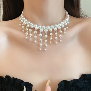 Close-up of an elegant French court style pearl fringe choker necklace on a model