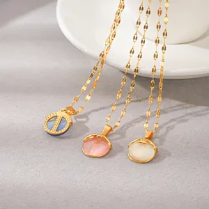 Detailed macro shot of three titanium steel necklaces with colorful cat's eye stones