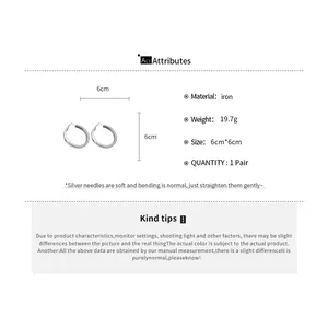 Close-up showing 6cm silver hoop earring dimensions and iron material specifications