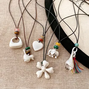 Bohemian leather cord necklaces set featuring silver charms and colorful beads detail