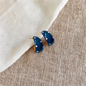 Vintage minimalist navy blue enamel earrings with white polka dots and silver needle studs