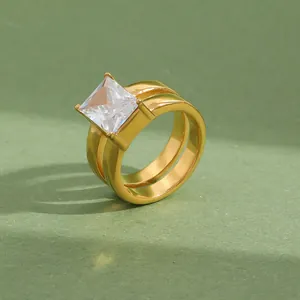 Close-up of gold-plated stainless steel double ring with square cut zircon stone.