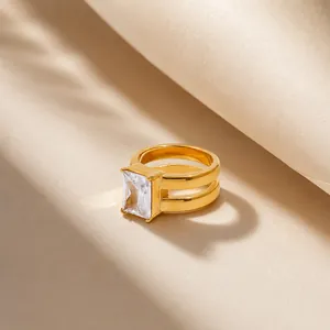 Close-up of double-layer 18K gold plated ring featuring a large square zirconia