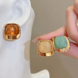 Set of three vintage acrylic square stud earrings in warm autumn colors for women
