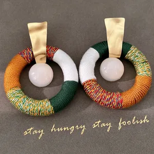 Ethnic cotton rope wrapped hoop earrings with white resin beads and gold studs