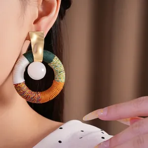 Bohemian cotton rope wrapped circular drop earrings with resin bead and gold finish