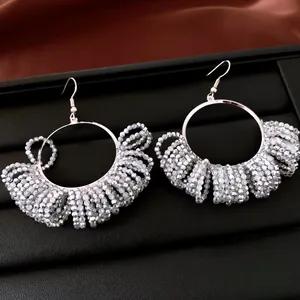 Detailed view of silver beaded hoop earrings with vintage grey crystal beads