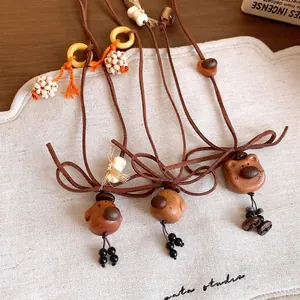 Lindos collares de madera de oso y cachorro hechos a mano con cordón de cuero marrón y lazo