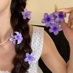 Set of three purple acrylic flower mini hair claws for romantic and sweet hair styling