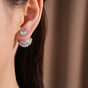 Elegant silver needle earrings featuring sparkling zircon studs and pearl jackets on ear
