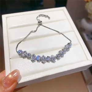 Detailed view of sparkling cubic zirconia stones on an 18k gold-plated silver bracelet