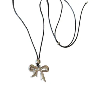 Adjustable silver bow pendant necklace with black cord for women, Korean style.