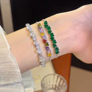 Close-up of sparkling heart-shaped zircon bracelets with high-end gold plating for women