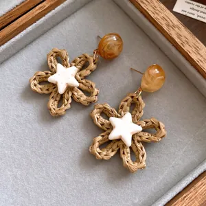 Vintage bohemian woven flower earrings with marbled resin beads and star accents