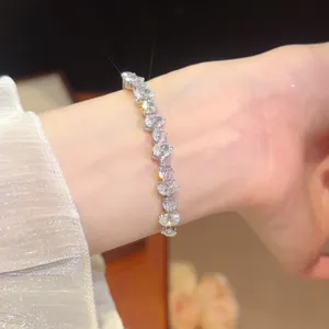 Close-up of luxury 18k gold-plated bracelet with sparkling oval-cut cubic zirconia