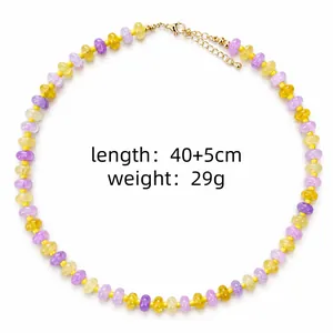 Close-up macro view of colorful glass bead necklace with length and weight information