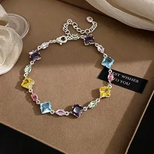 Detailed view of the colorful zircon stones in this candy-style geometric bracelet
