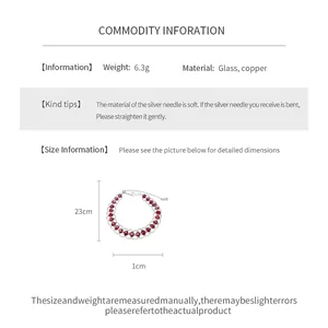 Detail des rot gepunkteten Mesh-Zugarmbands mit Abmessungen und Materialinfo