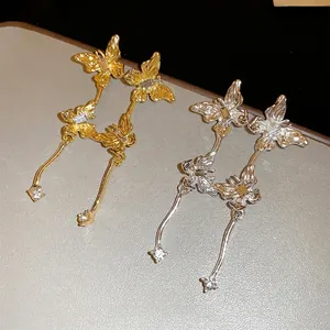 Elegant gold and silver butterfly tassel earrings with sparkling rhinestones