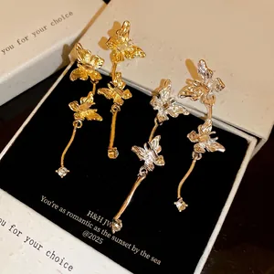 Elegant butterfly tassel drop earrings with sparkling crystals available in gold and silver