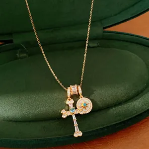 Close-up of elegant 18k gold-plated zircon necklace featuring a star and cross pendant