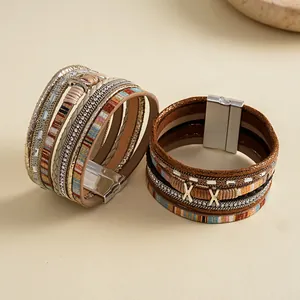 Detailed view of multi-layered bohemian leather bracelets with rhinestones and magnetic clasp