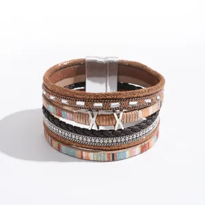 Elegant bohemian multi-layer leather wrap bracelet with sparkling rhinestones and braided cords.