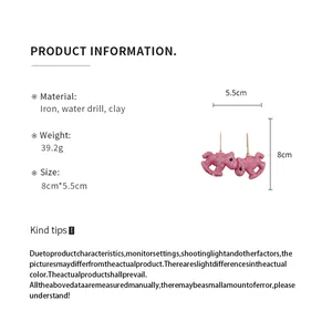 Product details and specifications for pink glitter rocking horse earrings with size measurements