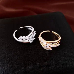 Close-up of 18k gold plated irregular open rings featuring sparkling cubic zirconia stones