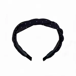 Schwarzes gepunktetes, gedrehtes Stoffstirnband für elegantes Haarstyling bei Frauen
