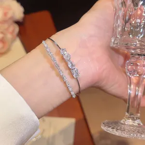 Close-up of elegant 18k gold plated double-layer bangle set with sparkling cubic zirconia