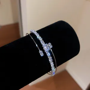 Macro view of luxurious 18k gold plated double-layer bracelet with sparkling stones