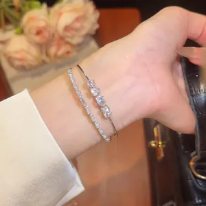 Detailed close-up of an 18k gold plated double layer bracelet set with sparkling zirconia